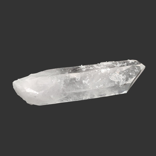 One large clear single quartz crystal point