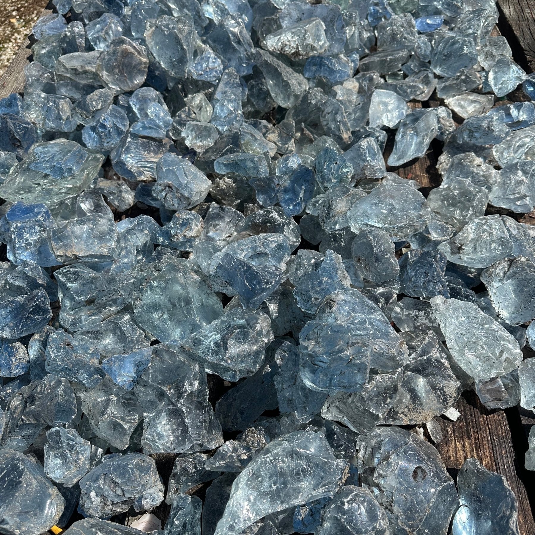 Table filled with light blue slag glass