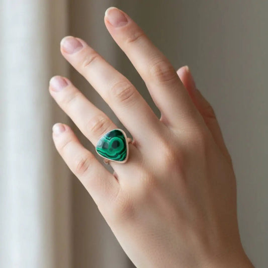 Sterling Silver and green Malachite ring on a woman's ring finger.