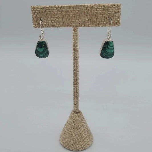 Malachite Silver Dangle Earrings on display stand