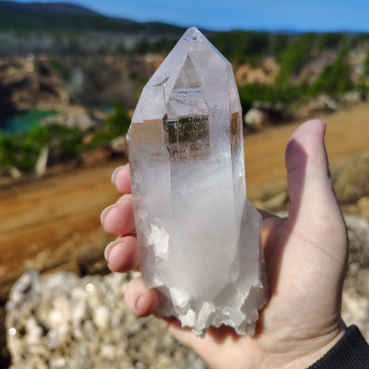 This is the front side of this Quartz crystal point, and its half clear and half white in color.