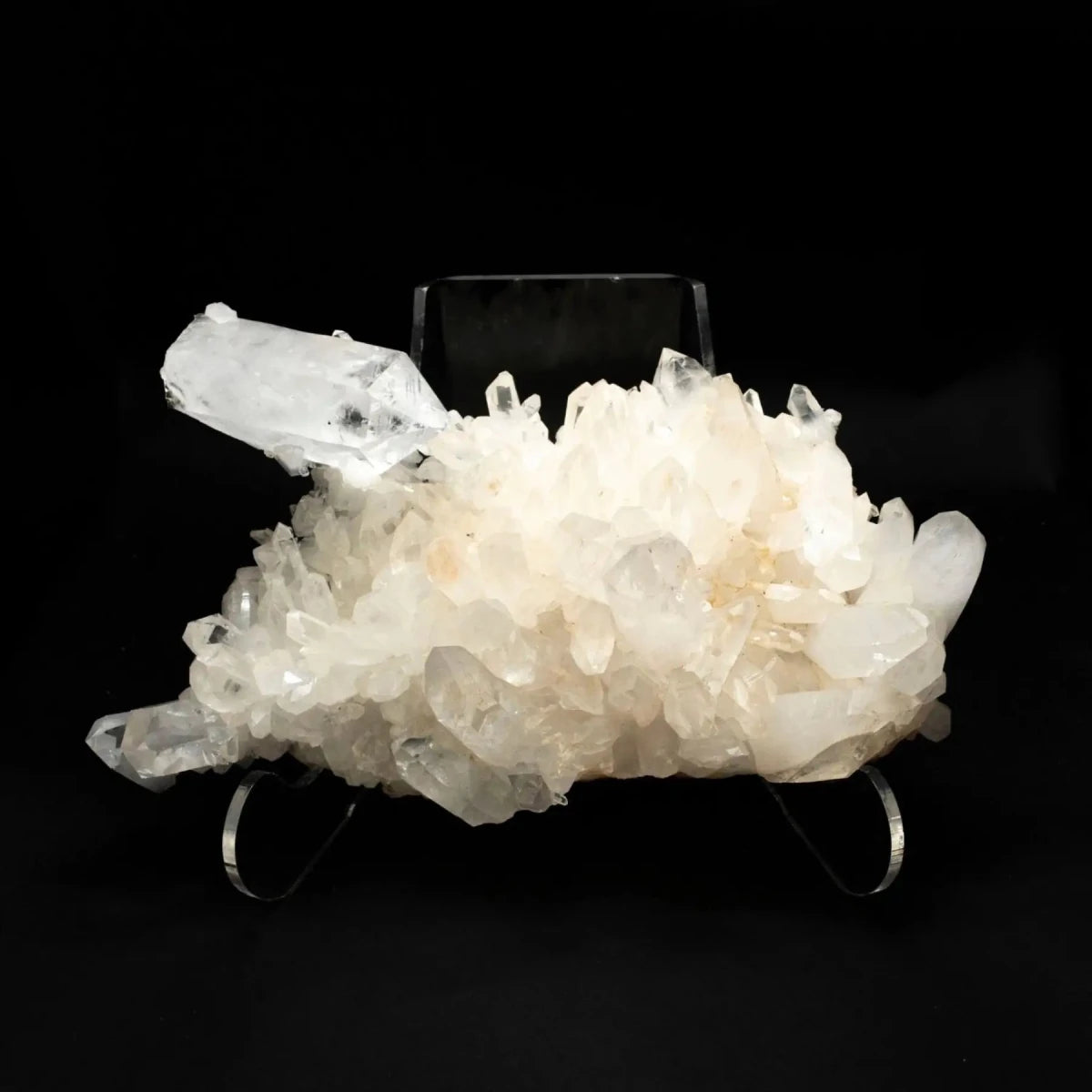 straight forward view of a crystal cluster on an acrylic display stand.  