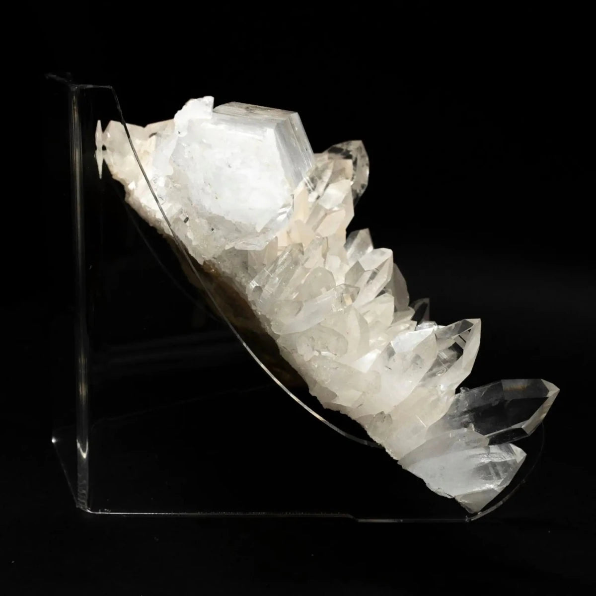 Alternate Side View of the clear crystal points within a cluster of crystals that is on an acrylic stand 