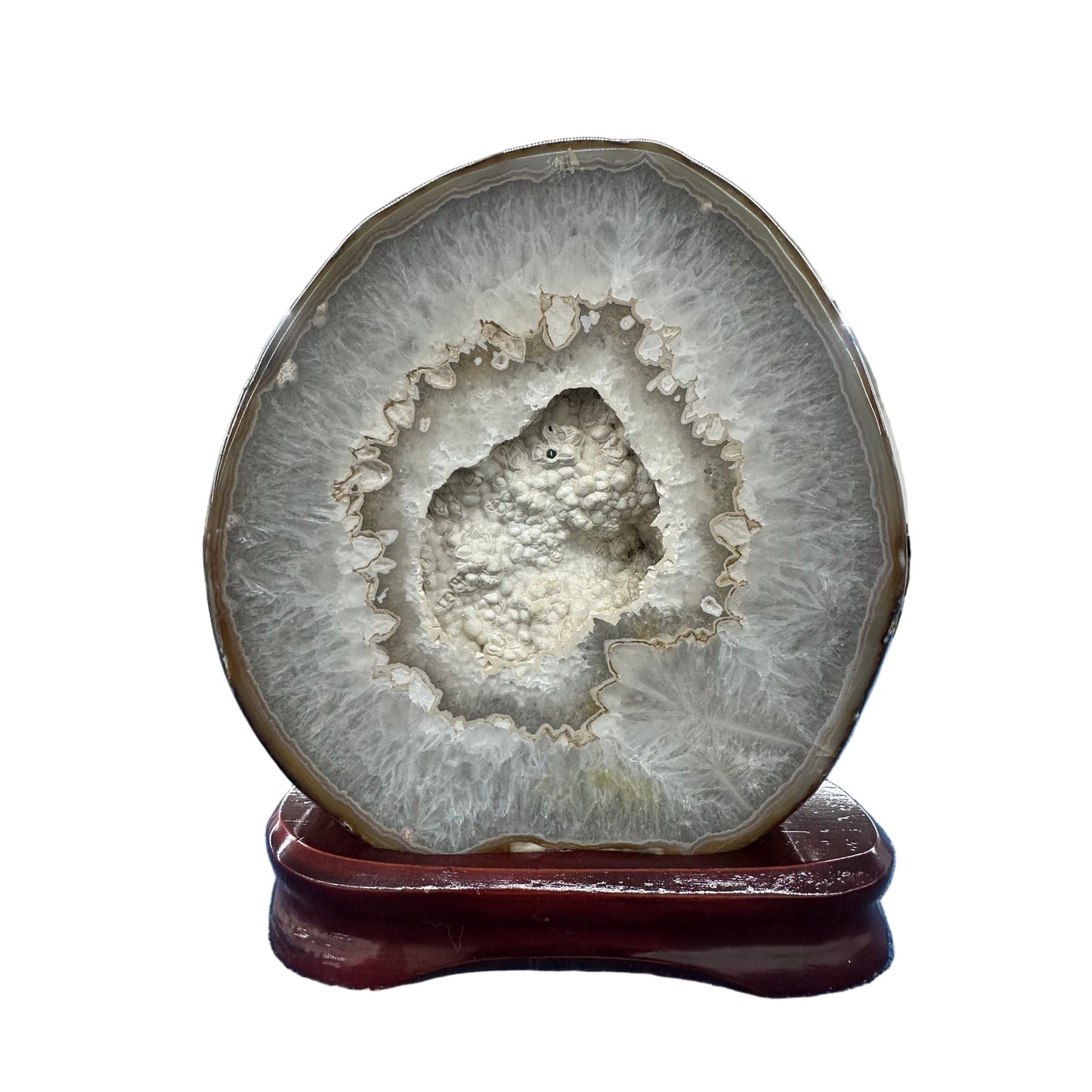 Agate with druzy specimen on wood stand