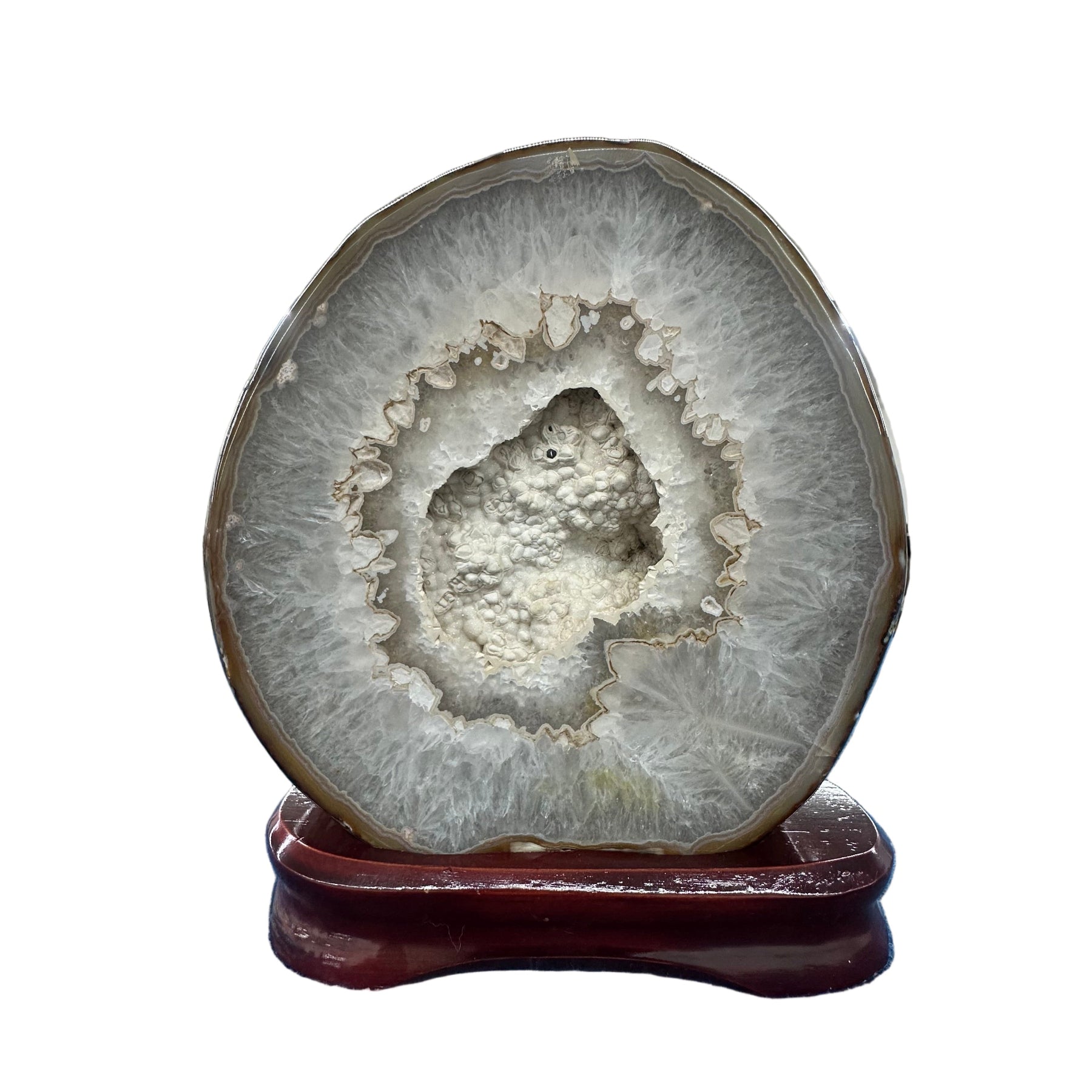 Agate with druzy specimen on wood stand