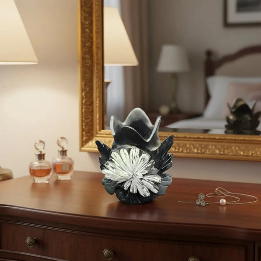This is the front view of this black and white Chrysanthemum Flower Stone Vase on a bedroom vanity.
