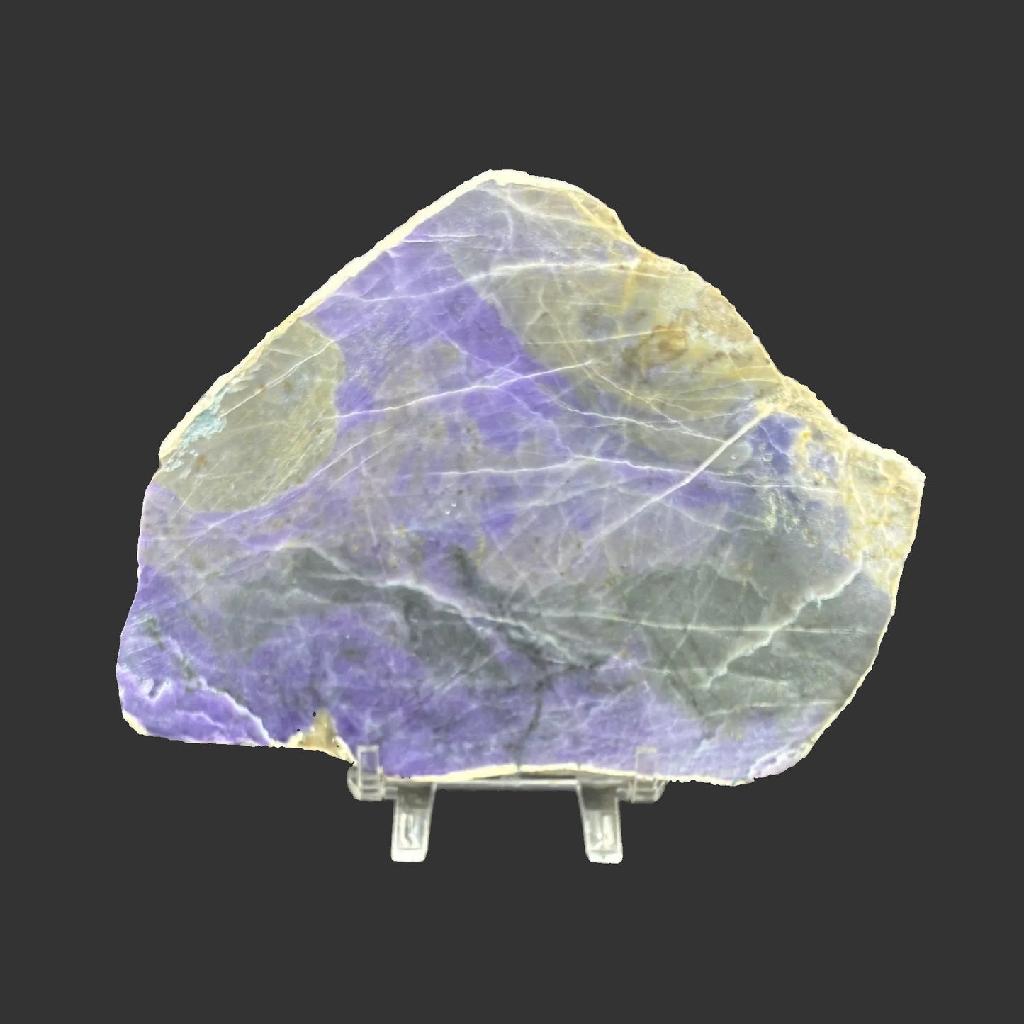This is the front side of this purple Opal slab. It is purple, black, and a little bit of white in color.