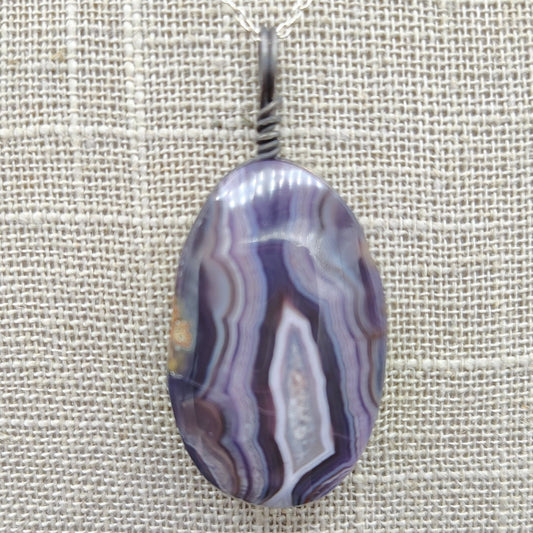 This is a close up of the purple Agate pendant