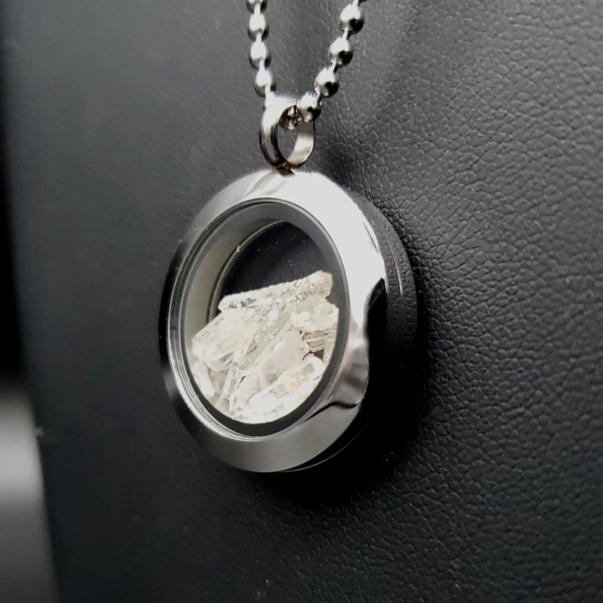 Side view of Clear Locket with Quartz Crystal