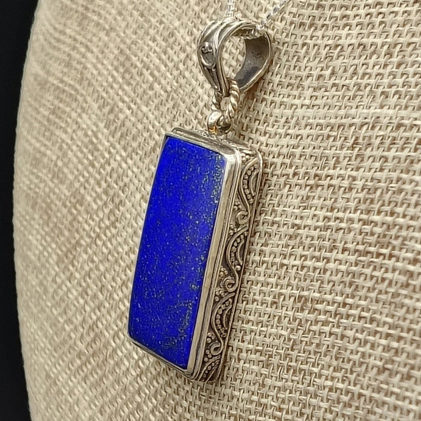 Close up of the design around the outside of the blue Lapis Lazuli gemstone pendant.