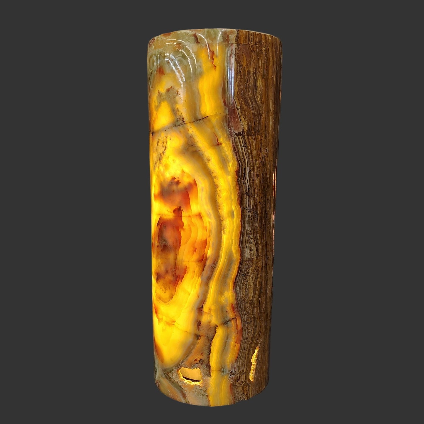 This is a close up of this polished onyx cylinder lamp