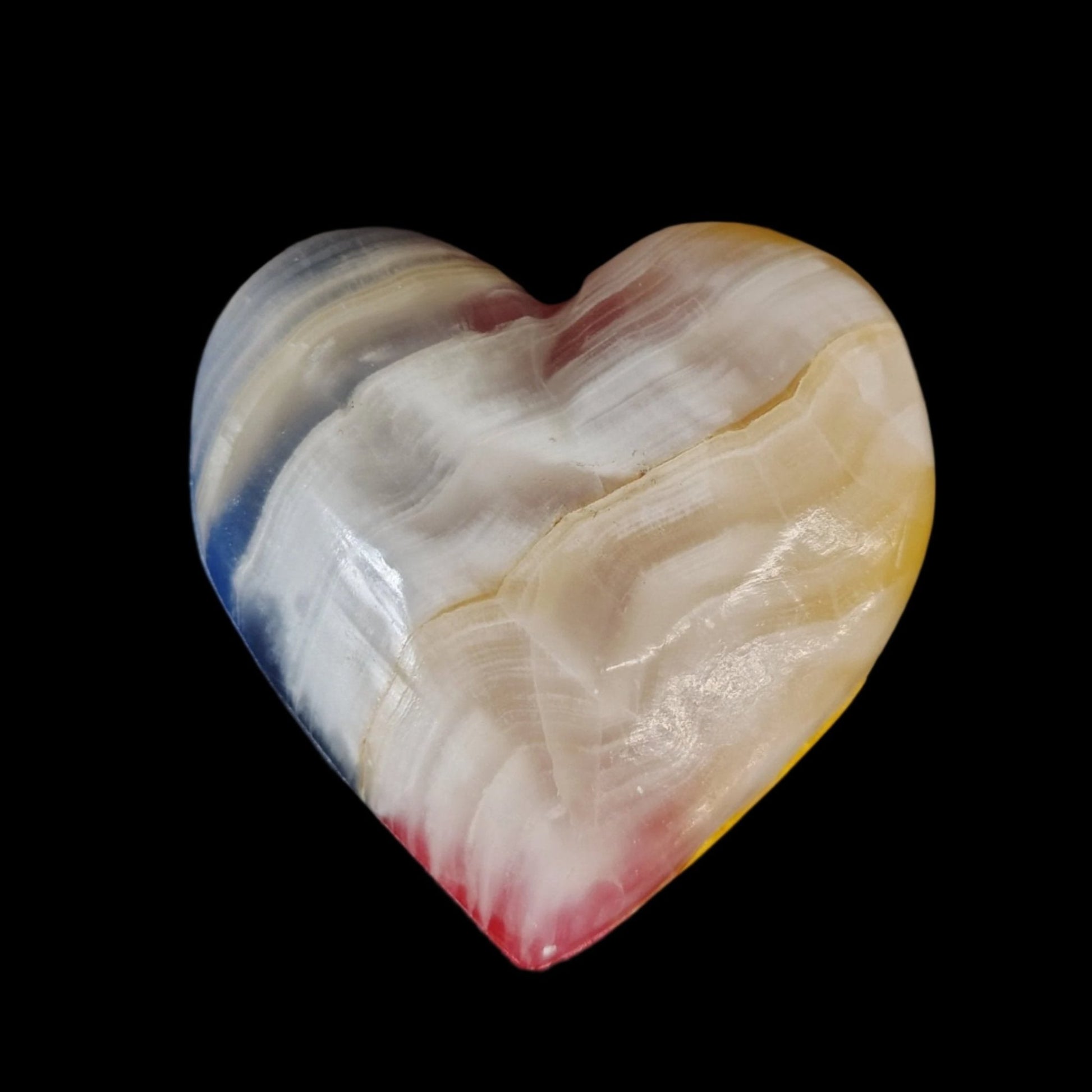 This is the back side of the rainbow Onyx heart, mostly white in color.