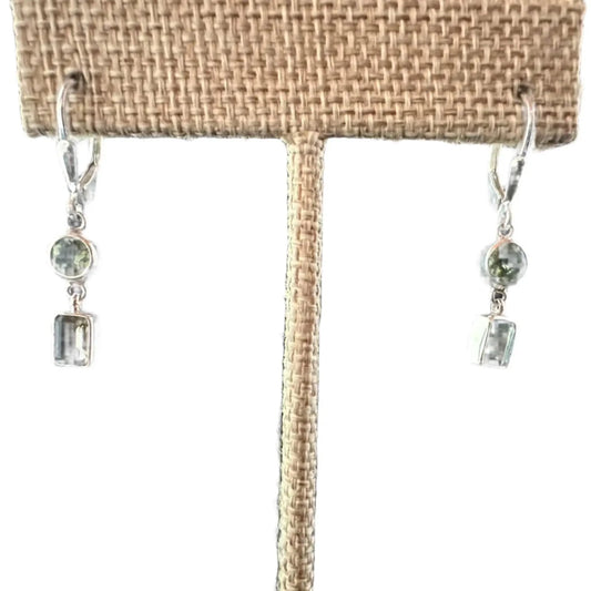 Close Up View Round Brilliant And Emerald Cut Peridot Earrings