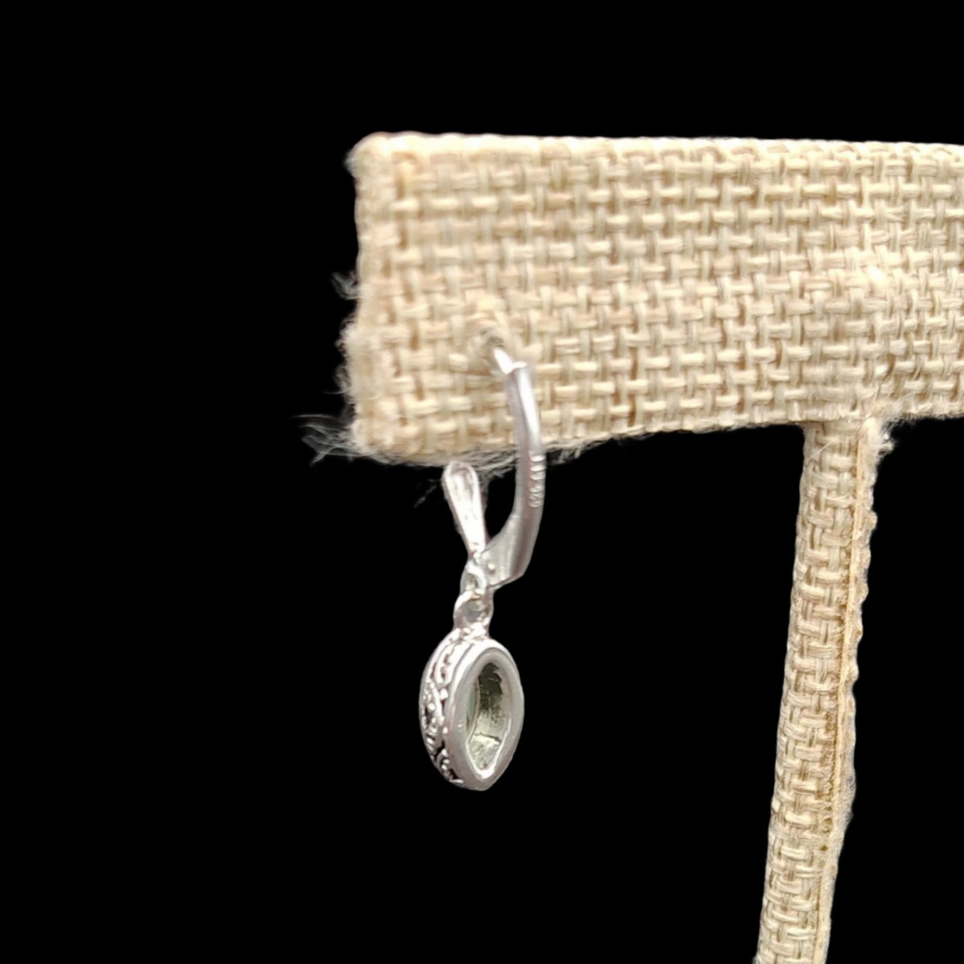 This is a close up of the back side of one of the Peridot earrings