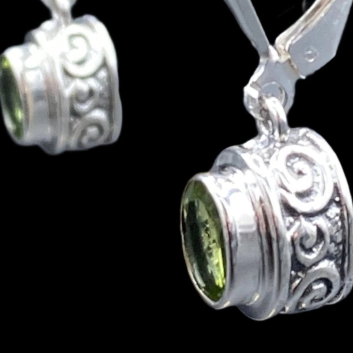 Close up of the design around the Peridot gemstones