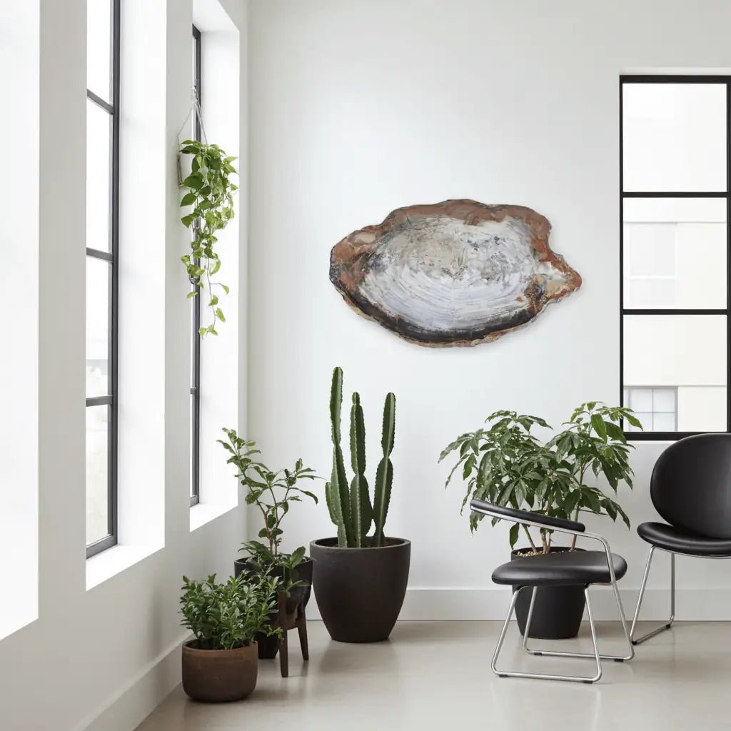 Modern interior with potted plants and a large wooden wall piece.