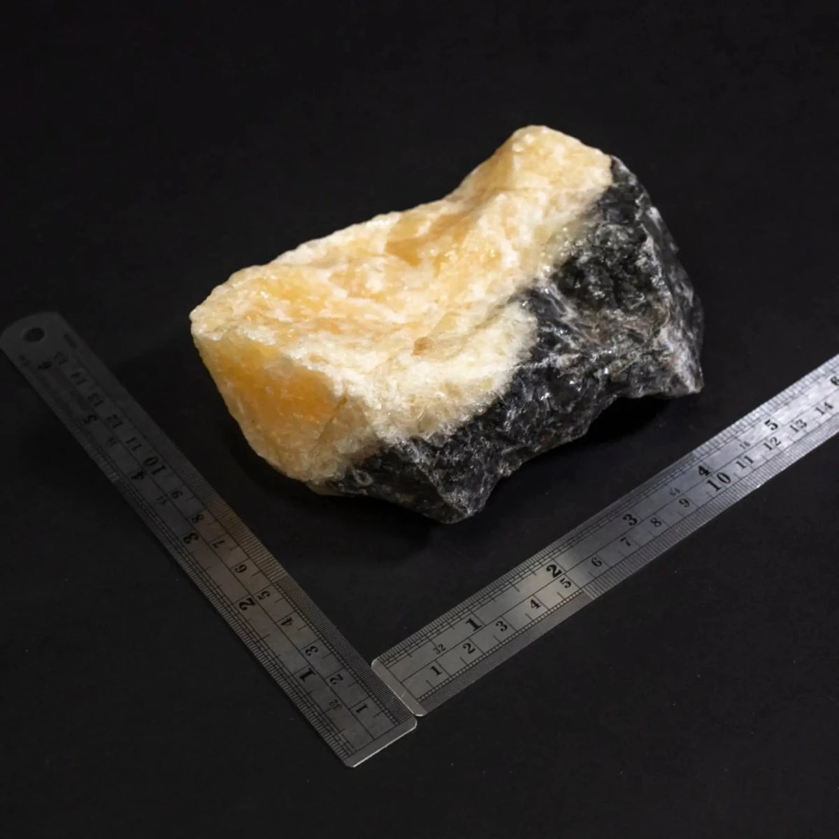 Phantom Calcite Raw Stone and a ruler