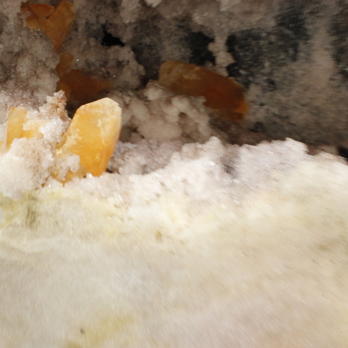 Close Up Of Calcite And Druzy Crystals Within An Amethyst Specimen