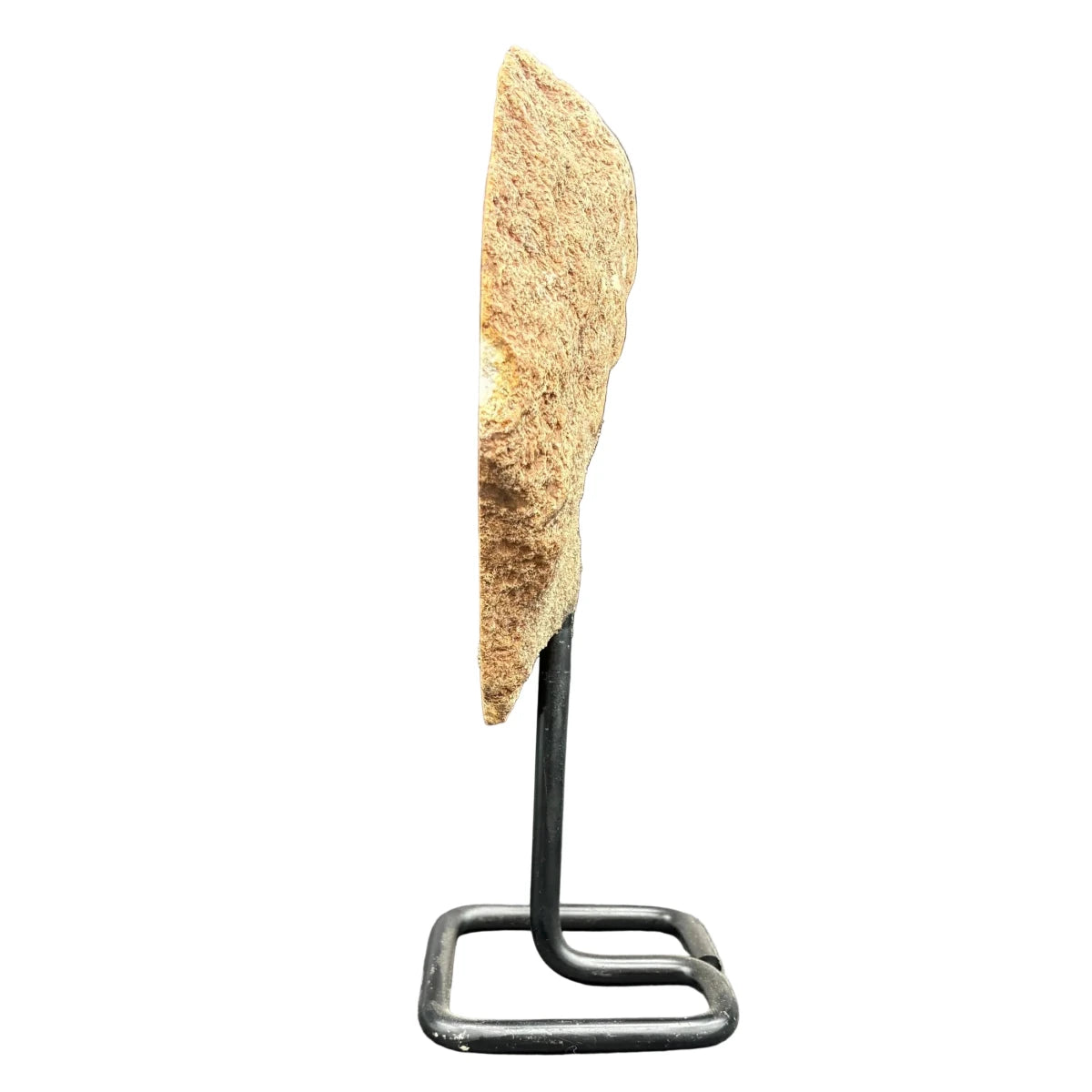 Side view of this pink amethyst on a stand and in front of a white background.