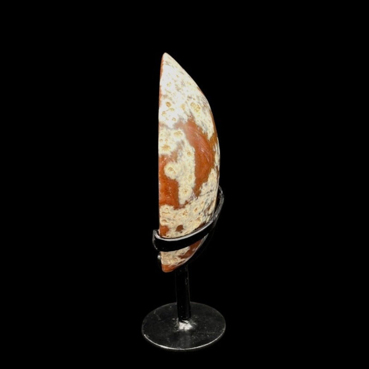 Side View Of Agate Specimen On Black Metal Stand, Marbled Cream And Brown