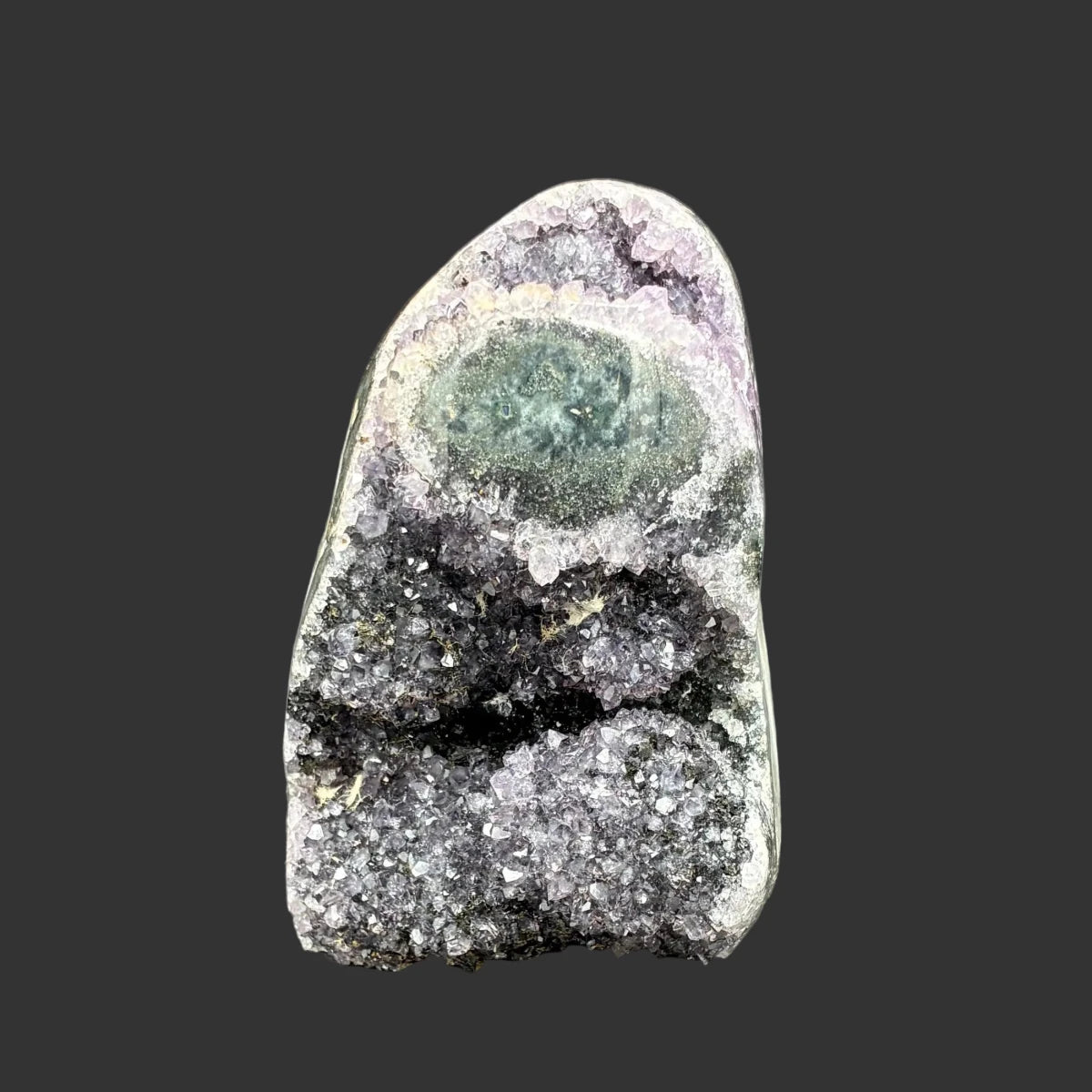 Front side of this purple amethyst cut base specimen, in front of a black background.
