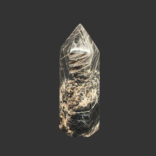This is the front side of this cut and polished black moonstone point.