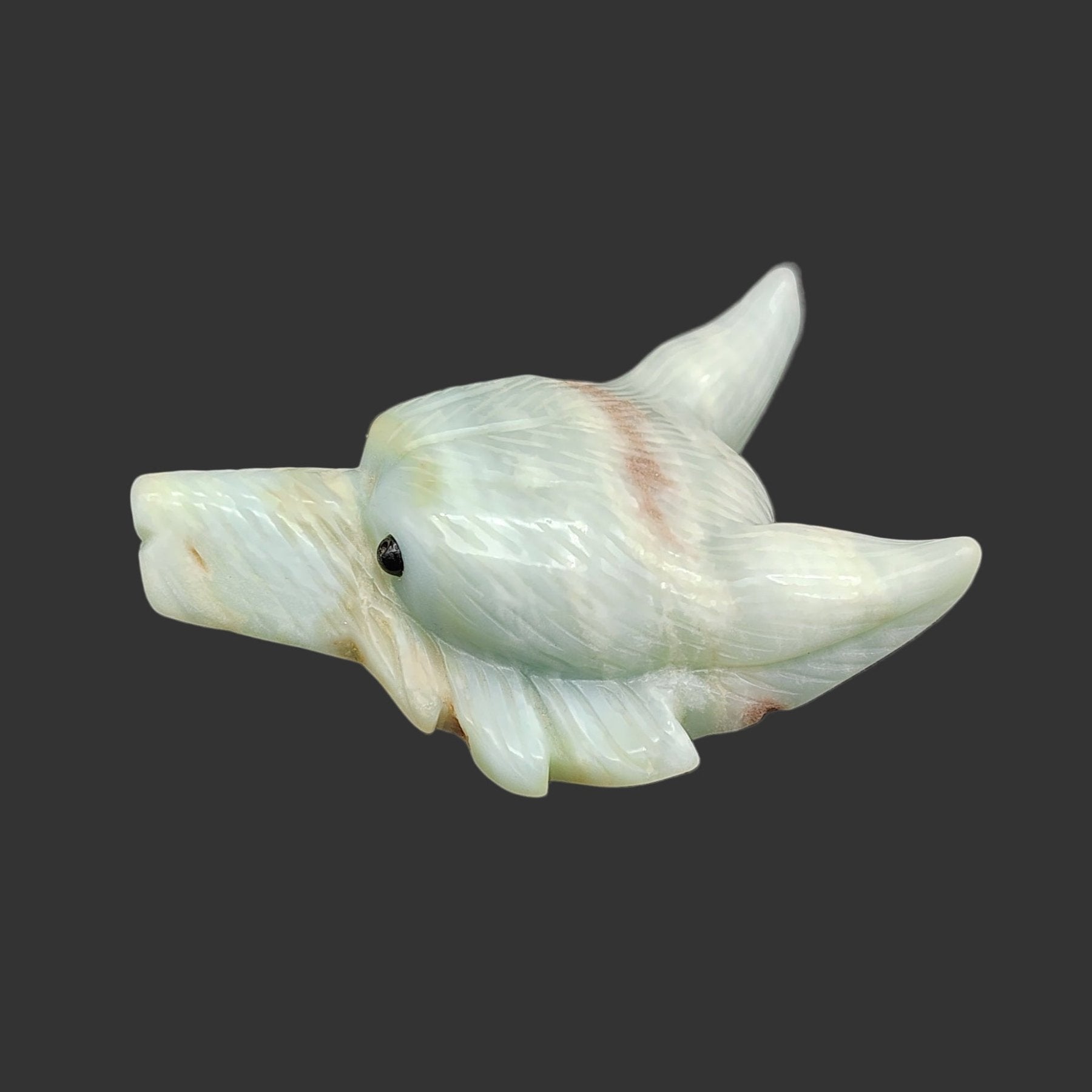 This is the left side of this of this hand carved amazonite wolf head figurine