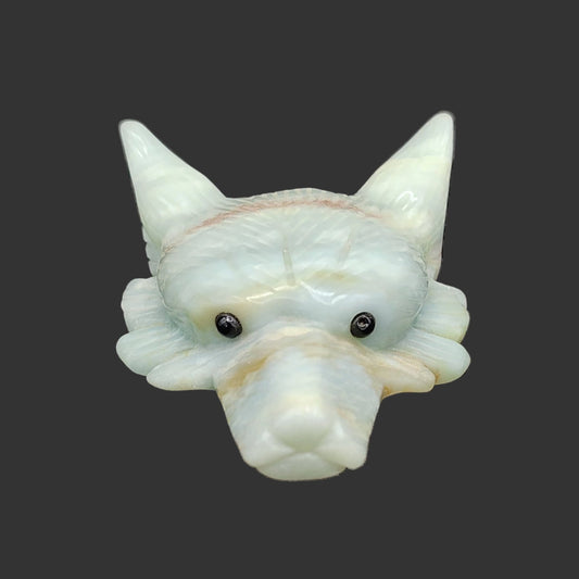 This is the front view of this hand carved and polished amazonite wolf head figurine