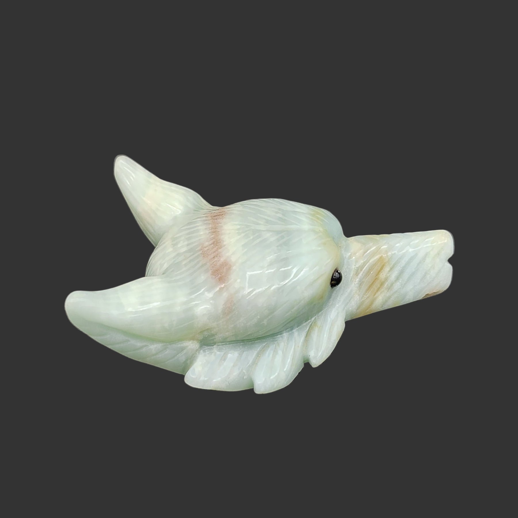 This is the right side of this amazonite wolf head figurine