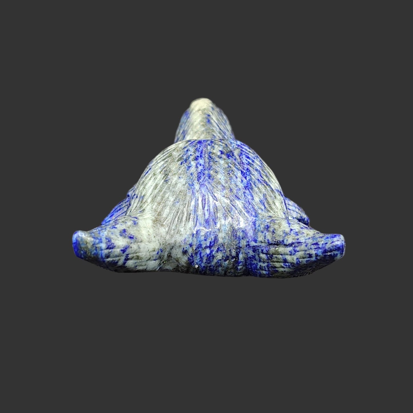 This is the back side of this lapis lazuli wolf figurine