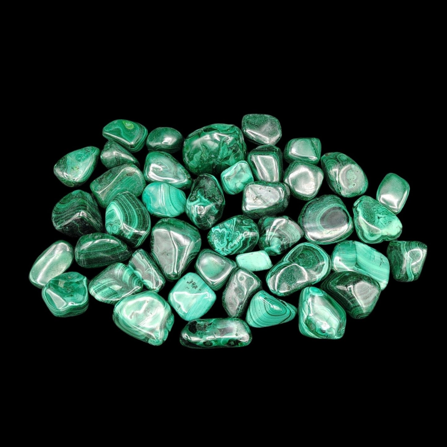 Top view of tumbled Malachite stones