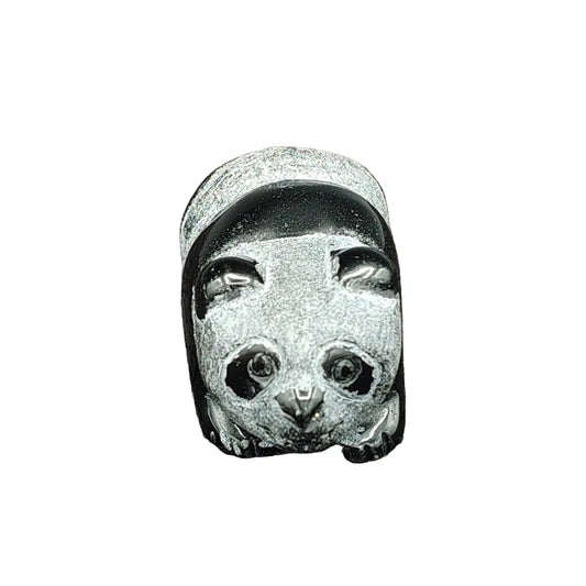This is the front view of this obsidian panda bear figurine