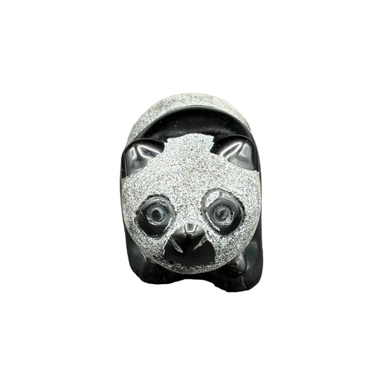 Front side of this obsidian panda in front of a white background.