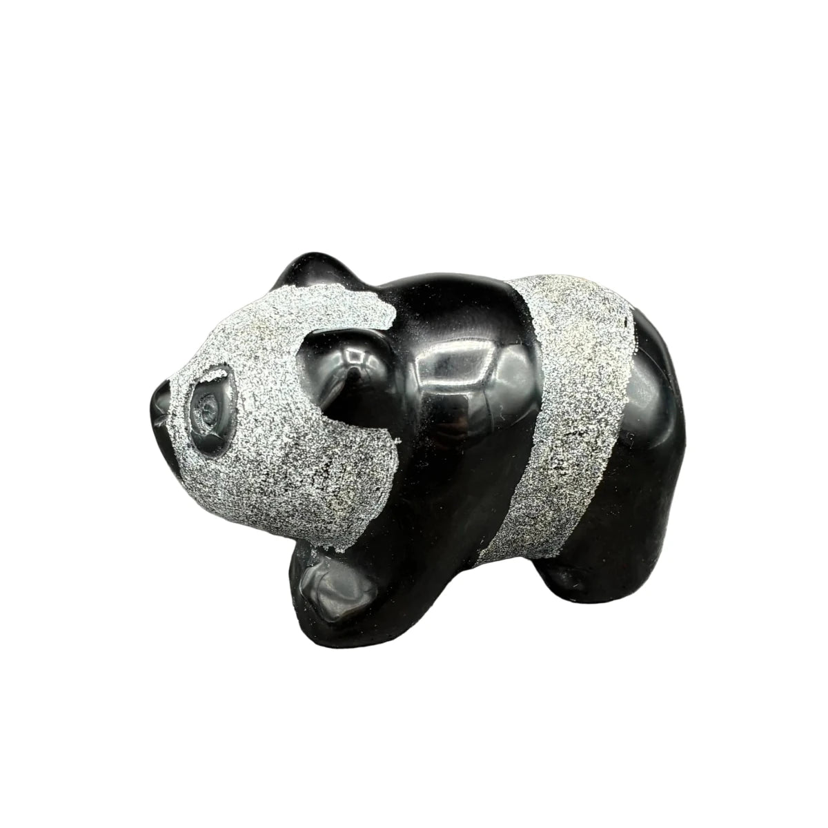 Side view of this obsidian panda in front of a white background.