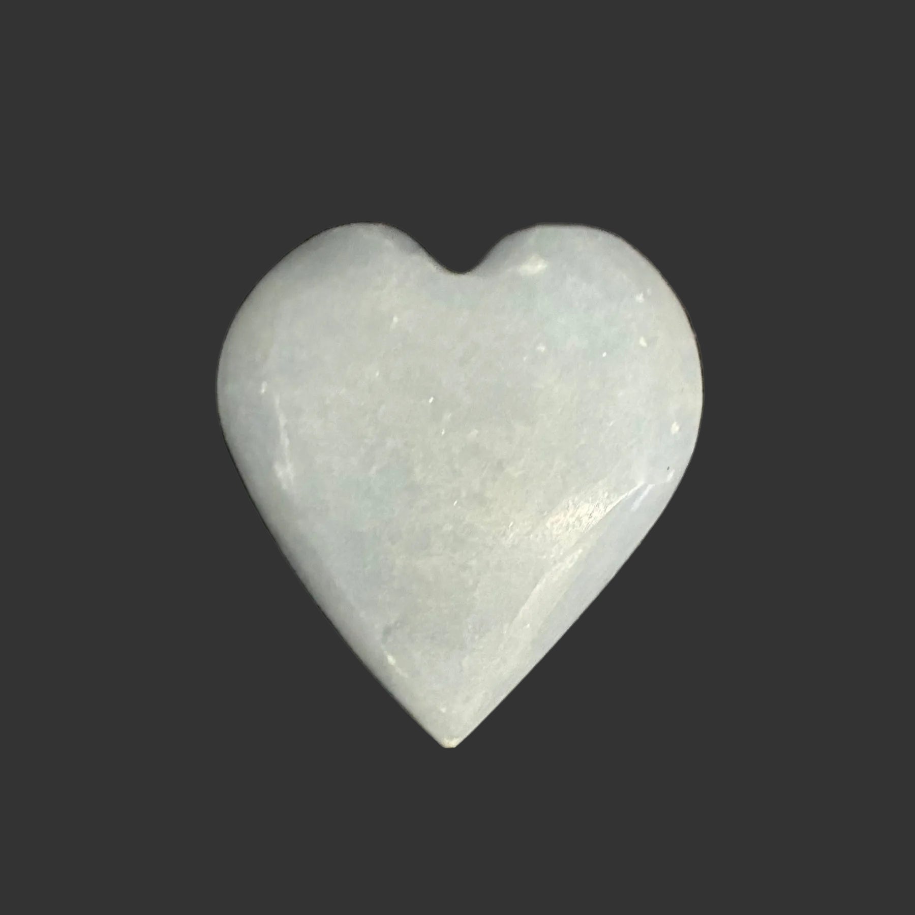 This is the front side of this polished blue Angelite heart palm stone.