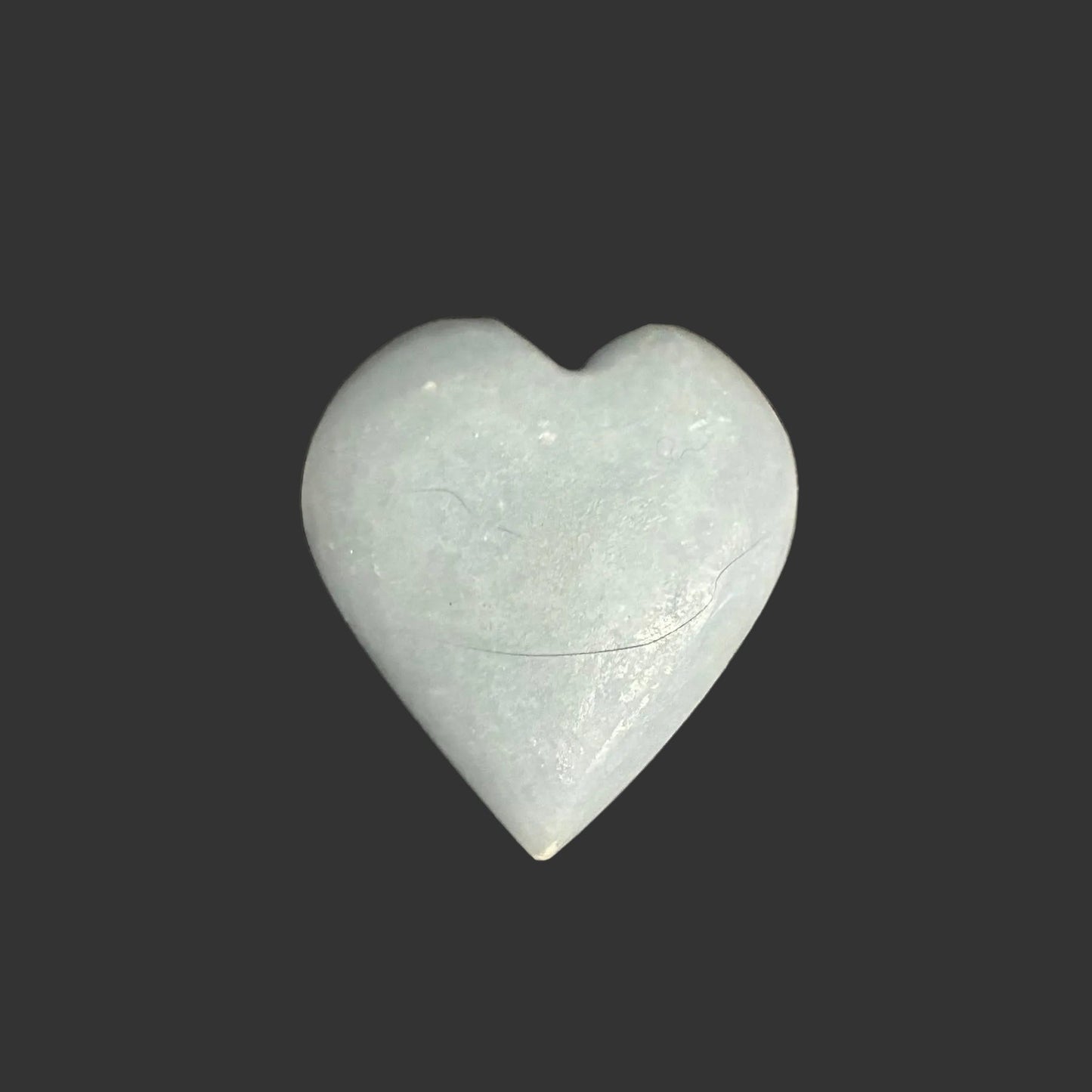 This is the back side of this polished blue Angelite palm stone.