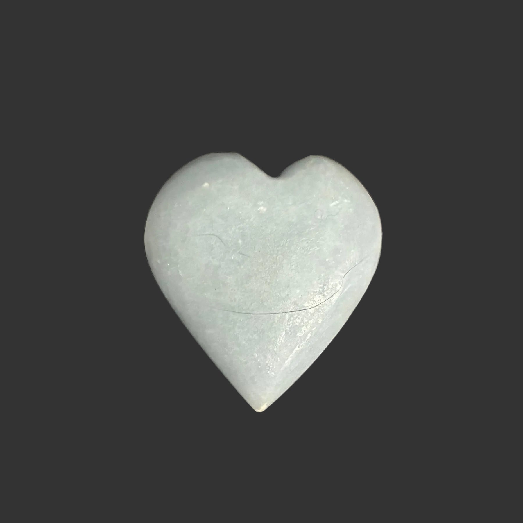 This is the back side of this polished blue Angelite palm stone.