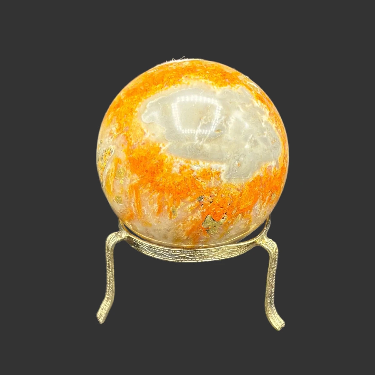 This is the front side of this sphere, in front of a black background.