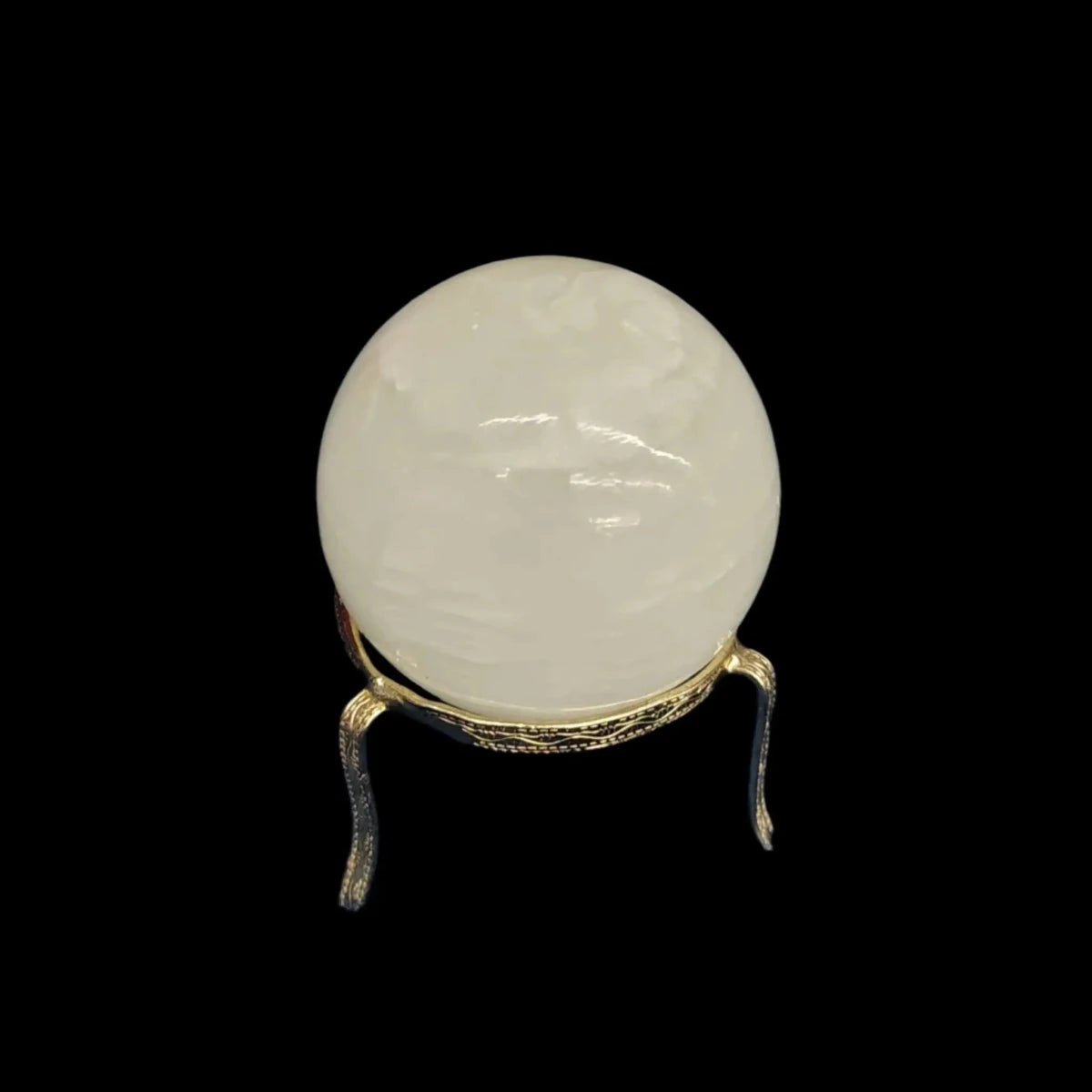 This is the polished green Calcite sphere in artificial light