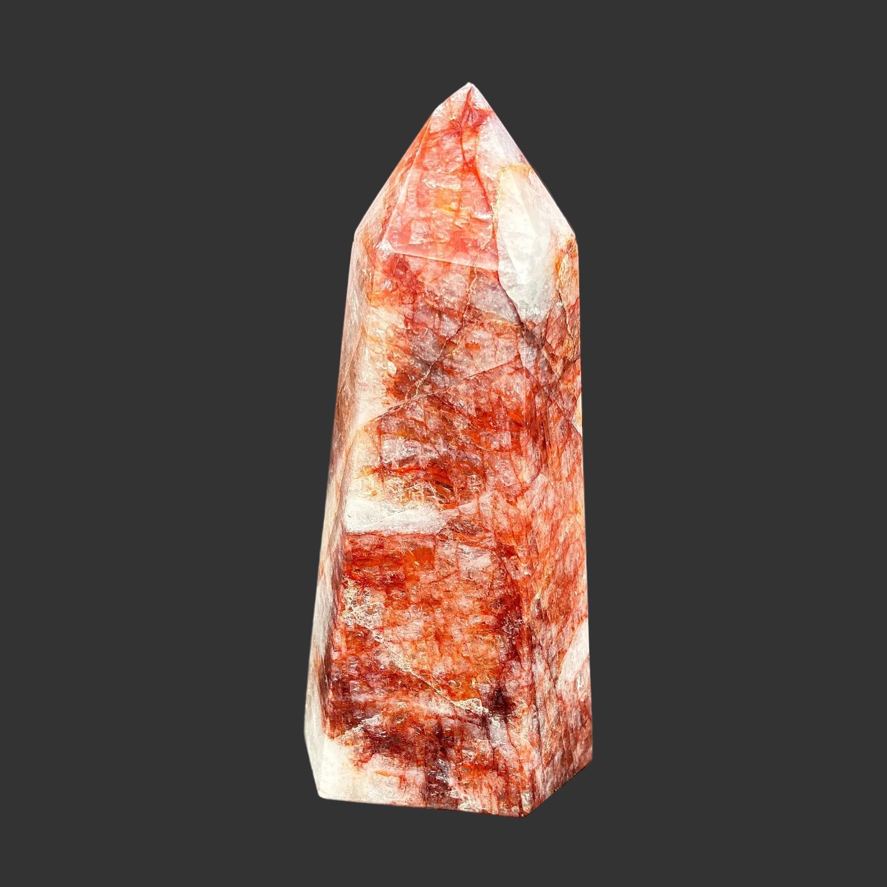 This is the back side of this polished red and white Hematoid tower.