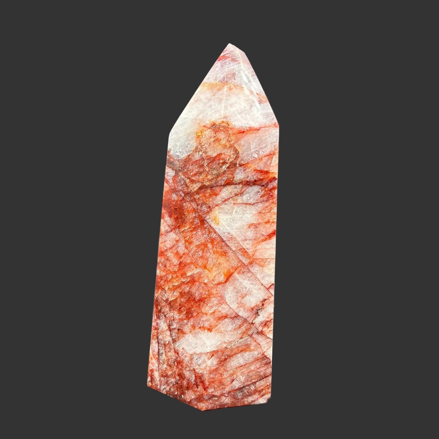 This is the right side of this polished red and white Hematoid tower.
