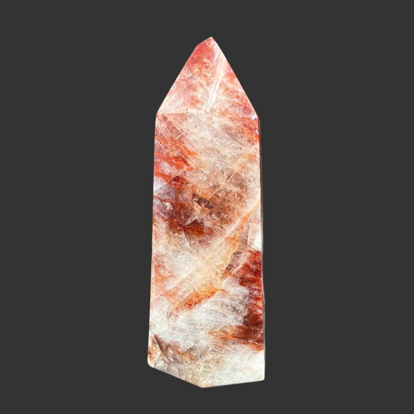 This is the left side of this polished red and white Hematoid tower.