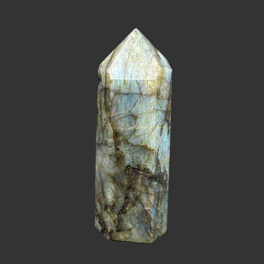 This is the front side of this polished labradorite point, it is blue, green, black and a little of yellow in color.