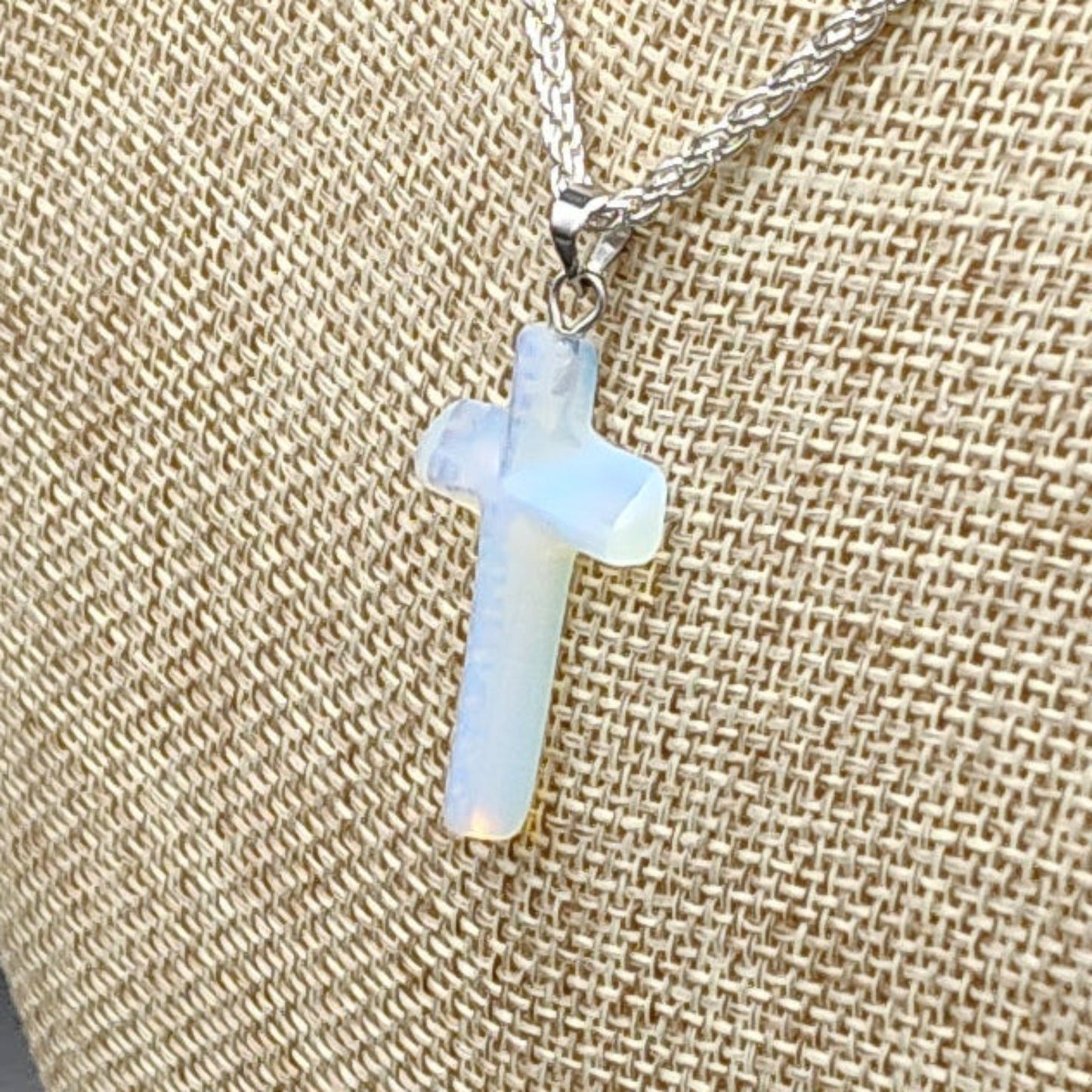This is a close up of the polished Opalite cross pendant.