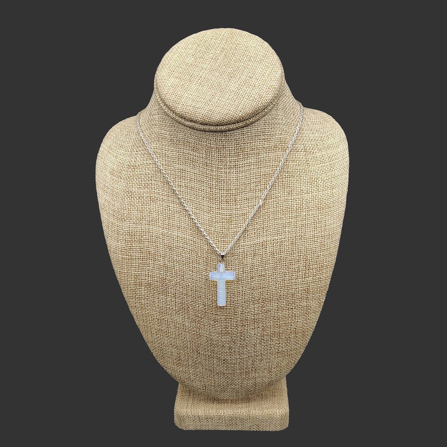 This is a polished Opalite cross, on a Sterling Silver chain.