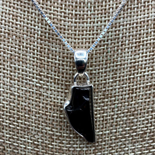 Close Up Of Shungite Pendant And Box Chain