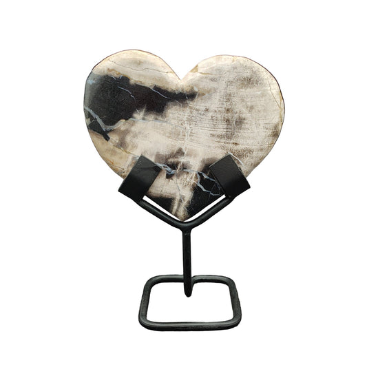 This is the front side of this petrified wood heart on a metal stand