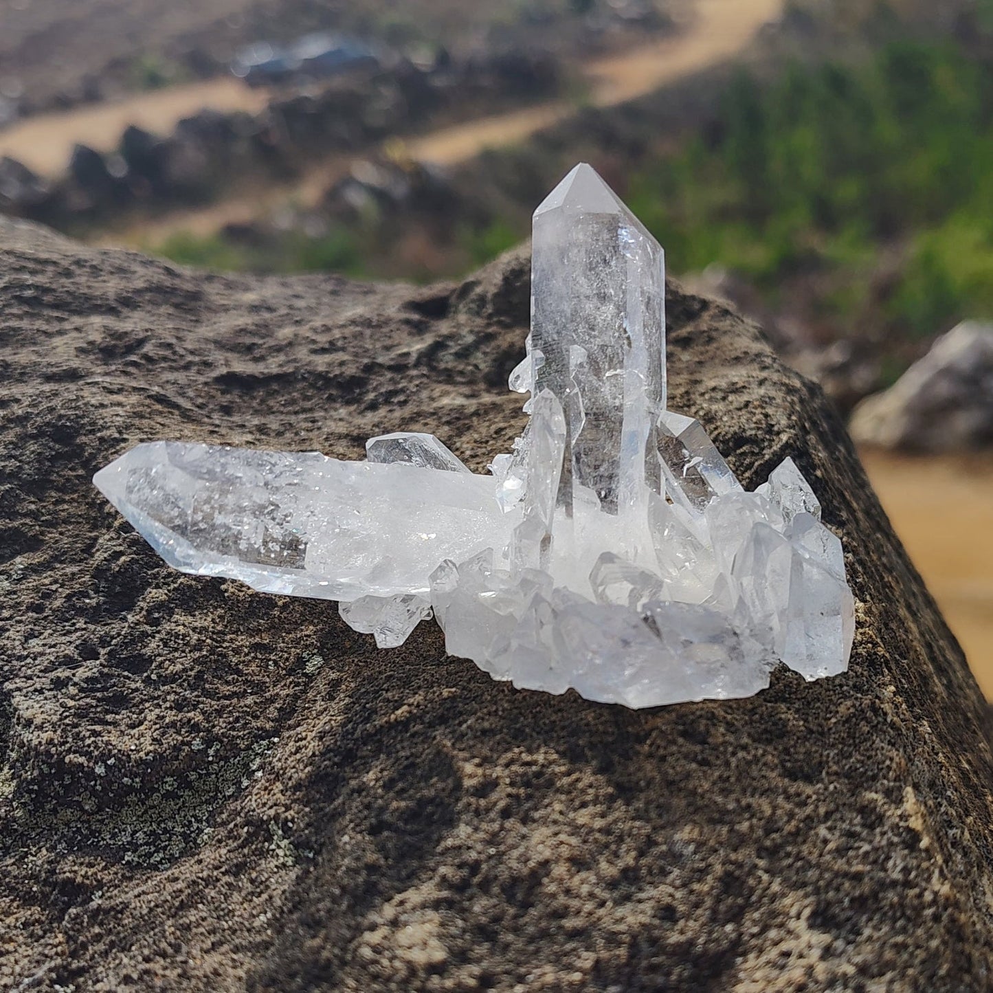 Front side of this pristine quartz crystal cluster in nature outside.