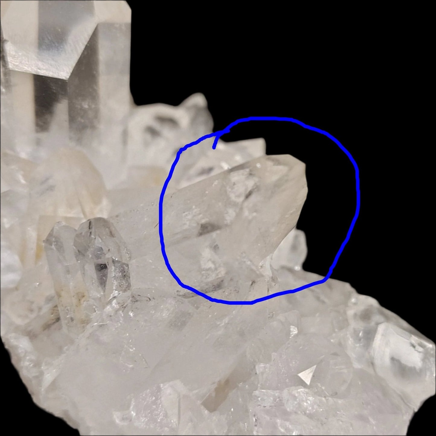 This is a close up of a broken Quartz crystal point on the left side of the cluster