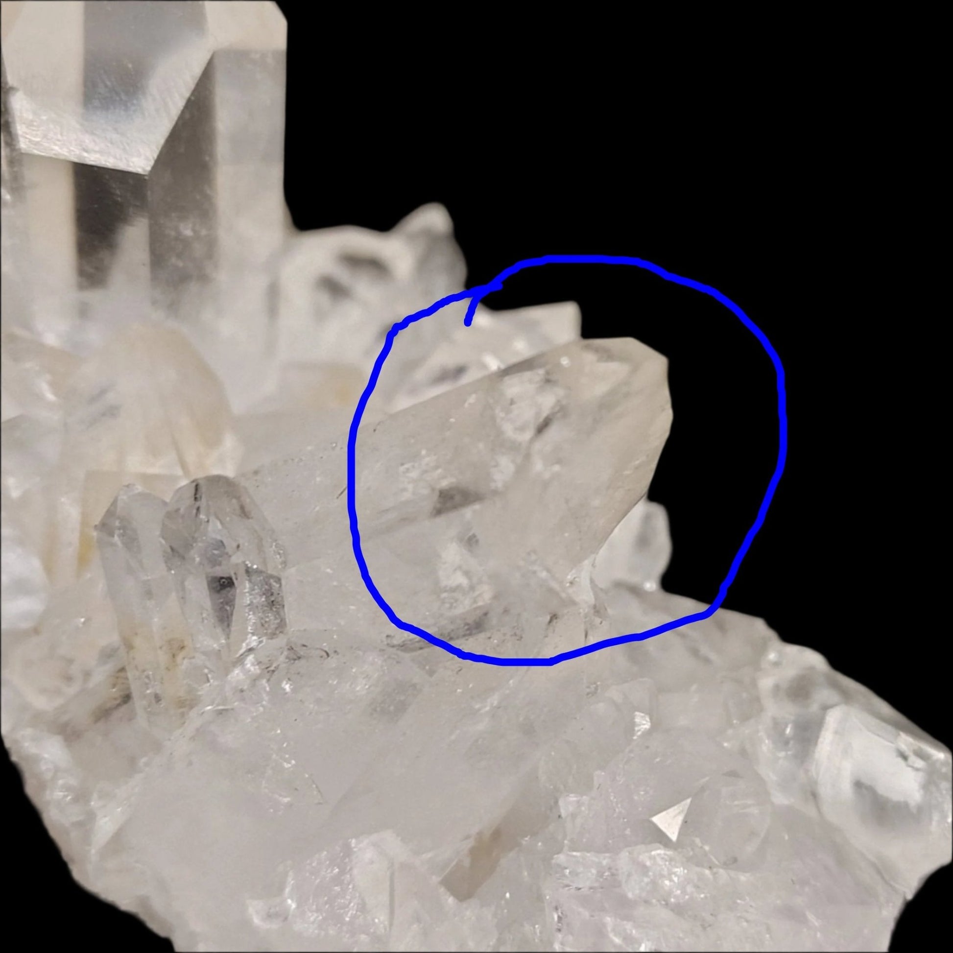 This is a close up of a broken Quartz crystal point on the left side of the cluster